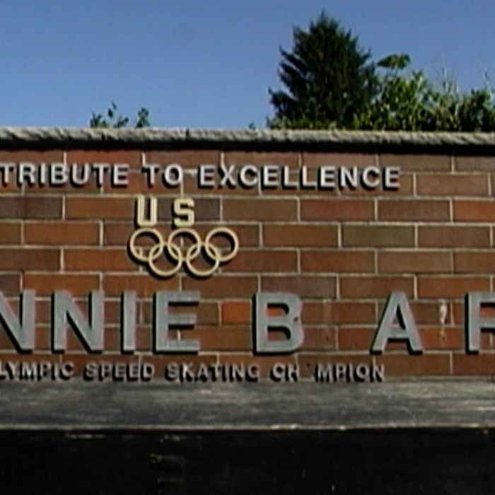 A monument missing letters due to disrepair.