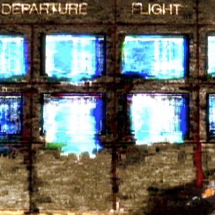 A glitchy image a bank of monitors.