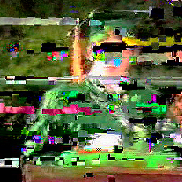 A glitchy image of a young man in graduation clothing.
